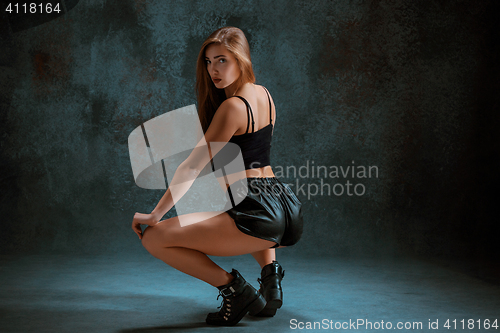 Image of Attractive girl dancing twerk in the studio