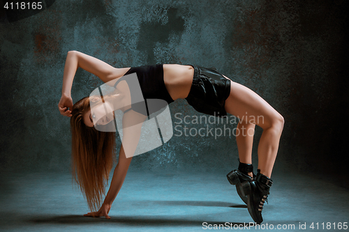 Image of Attractive girl dancing twerk in the studio