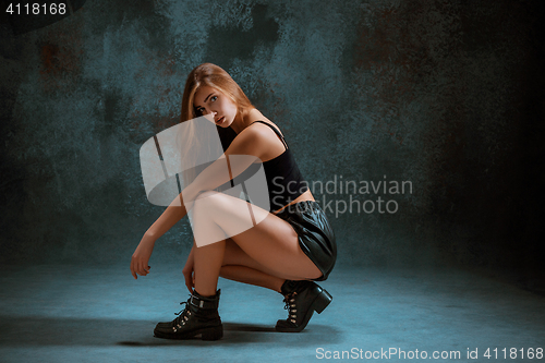 Image of Attractive girl dancing twerk in the studio