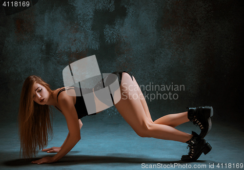 Image of Attractive girl dancing twerk in the studio