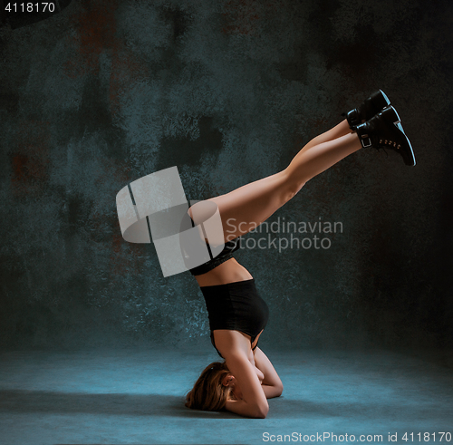 Image of Attractive girl dancing twerk in the studio