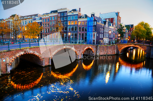 Image of Amsterdam city view with canals and bridges