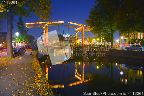 Image of Amsterdam city view with canals and bridges