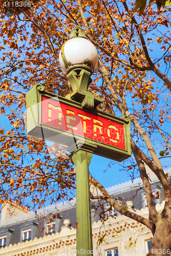 Image of A pole with metro sign