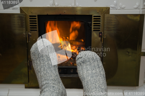 Image of Feet in front of fireplace