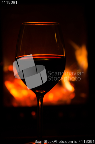 Image of Wineglass by a cozy fire