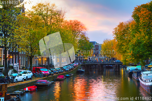 Image of Amsterdam city view with canals and bridges