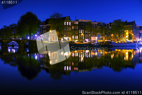 Image of Amsterdam city view with canals and bridges