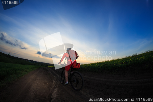 Image of Young man is riding bicycle outside. Healthy Lifestyle.