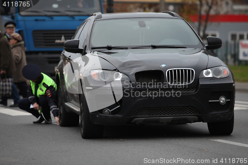 Image of  car hit a pedestrian in a crosswalk