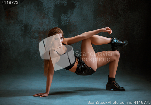 Image of Attractive girl dancing twerk in the studio