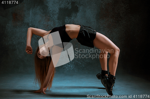 Image of Attractive girl dancing twerk in the studio