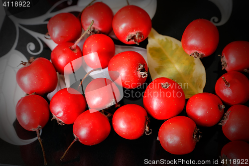 Image of Hawthorn berries on a plate .