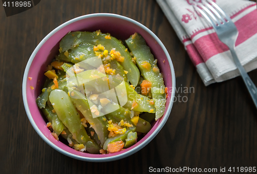 Image of Marinated cucumbers with carrots and spices.