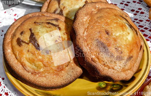 Image of Two delicious cupcakes on a ceramic dish