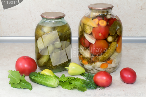Image of  A variety of canned vegetables in glass jars.