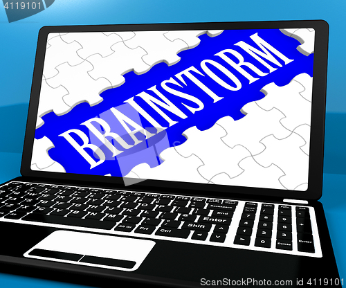 Image of Brainstorm Puzzle On Notebook Showing Ideas For E-book