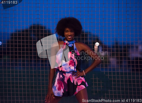 Image of portrait of a young African-American woman in a summer dress