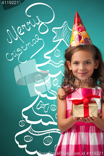 Image of The cute cheerful little girl on blue background