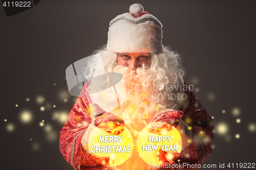 Image of happy Santa Claus looking at camera