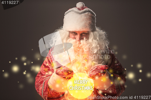 Image of happy Santa Claus looking at camera