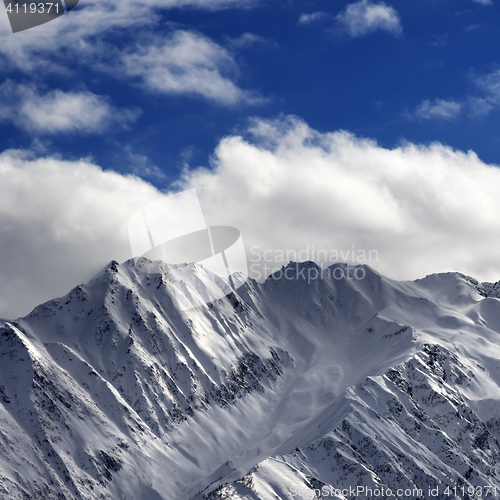 Image of Snow winter mountains and sunlight cloud sky in evening