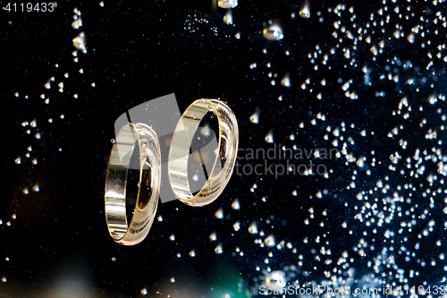 Image of Golden Rings In The Water