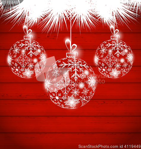 Image of Christmas balls made in snowflakes on wooden background