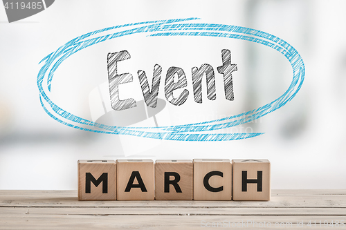 Image of March event with a wooden sign