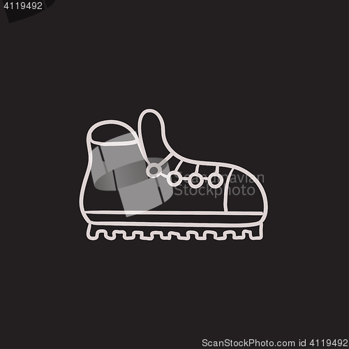 Image of Hiking boot with crampons sketch icon.