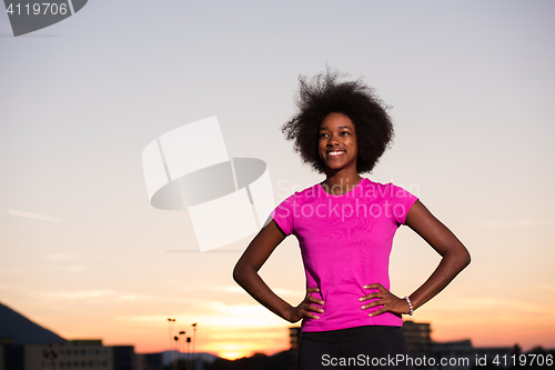 Image of Portrait of a young african american woman running outdoors