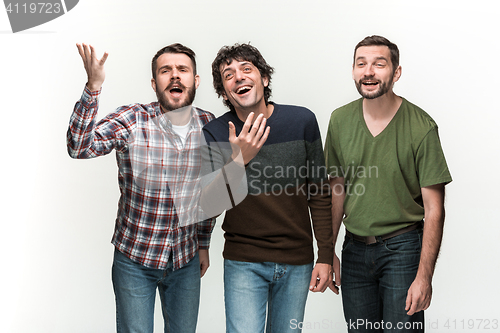 Image of The three men are smiling, looking at camera