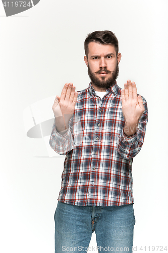 Image of Man is looking serious. Over white background