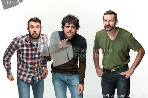 Image of The three men are smiling, looking at camera