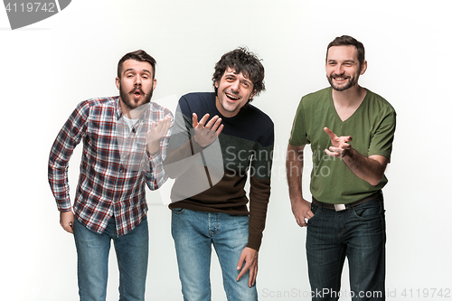 Image of The three men are smiling, looking at camera