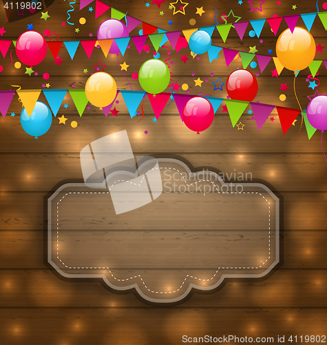 Image of Colorful balloons, hanging flags on wooden texture, place for yo