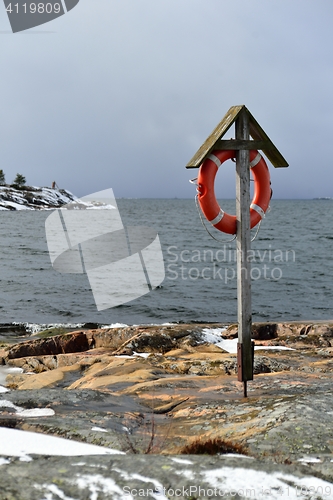 Image of Lifebuoy on a rocky coast