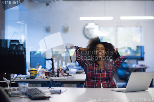 Image of young black woman at her workplace in modern office  African-Ame