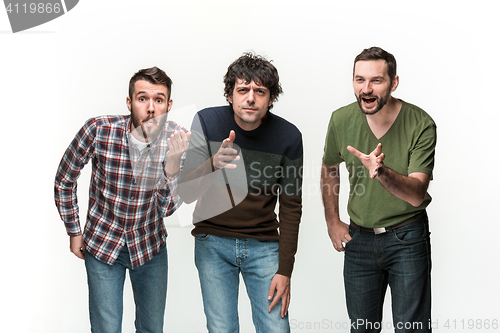 Image of The three men are smiling, looking at camera