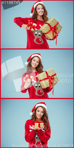 Image of Girl dressed in santa hat with a Christmas gifts