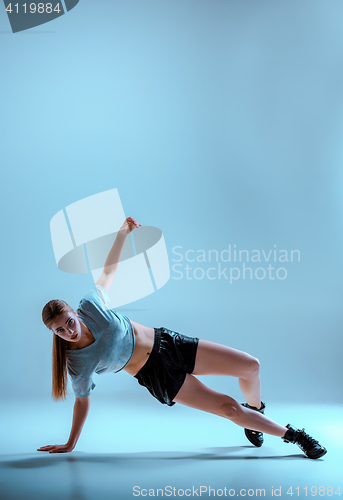 Image of Attractive girl dancing twerk in the studio