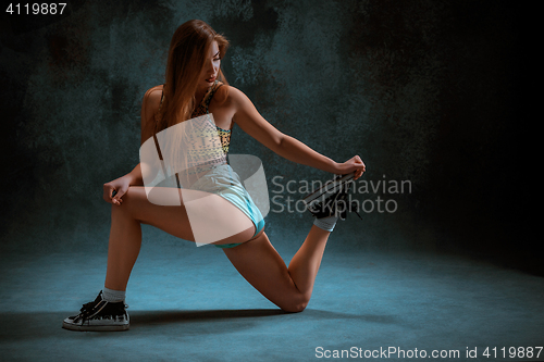 Image of Attractive girl dancing twerk in the studio