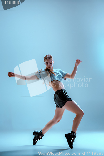 Image of Attractive girl dancing twerk in the studio