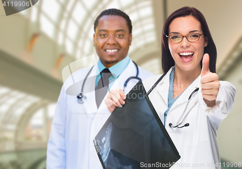 Image of Female and Male Caucasian and African American Doctors in Hospit