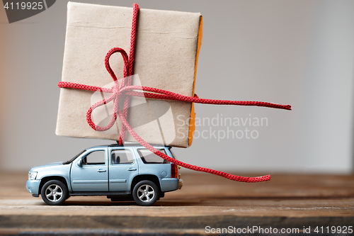 Image of Postcard with car carrying gift