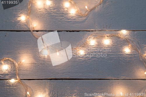 Image of Christmas festoon on wooden floor