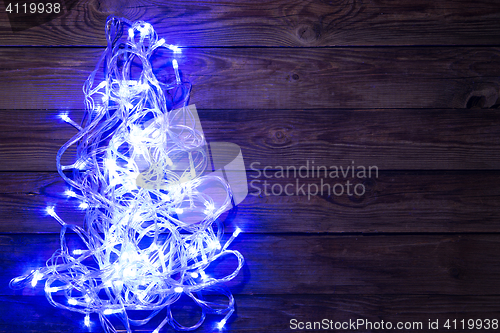 Image of Christmas garland shining blue color