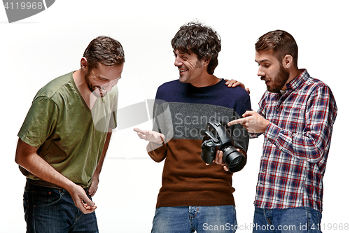 Image of Friends with camera on white