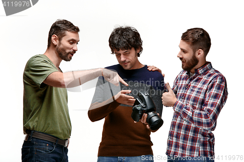 Image of Friends with camera on white