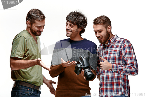 Image of Friends with camera on white